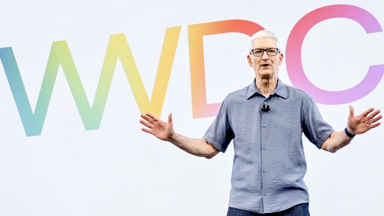 Apple CEO Tim Cook in front of the letters WWDC in different colors