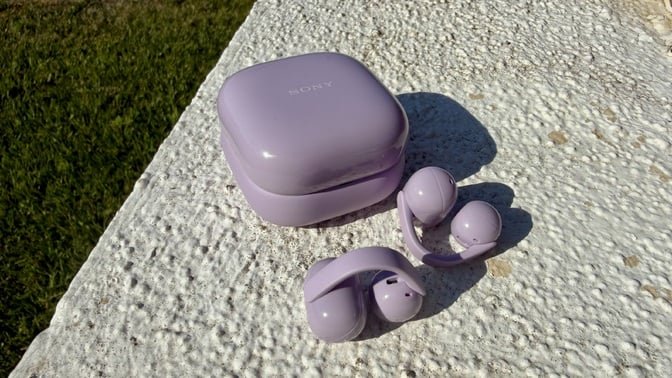 purple sony open earbuds on ledge outside